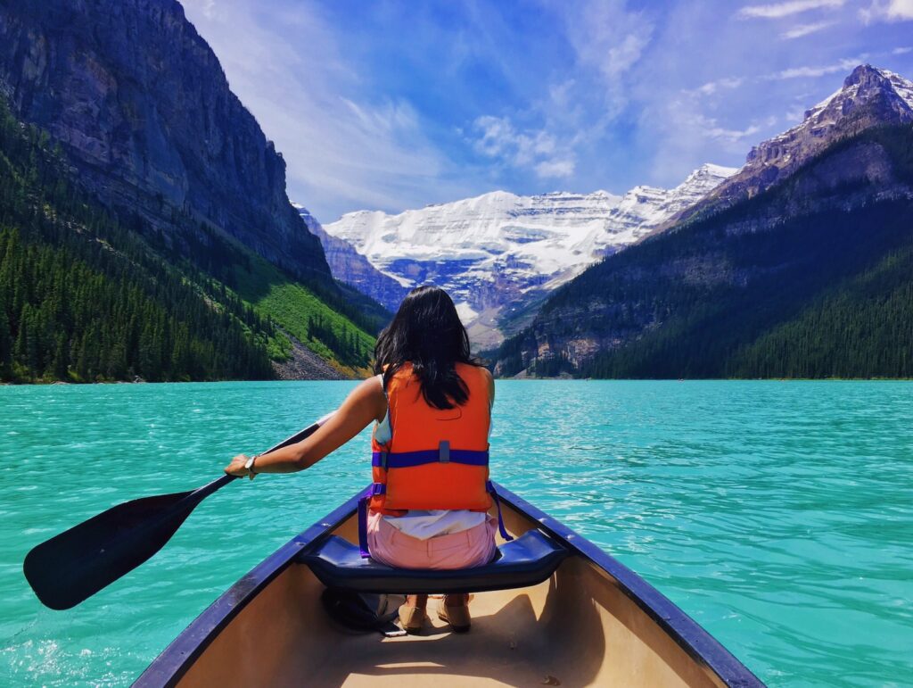 lady on a boat at Lake Louise 